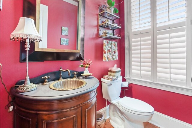 bathroom with vanity and toilet