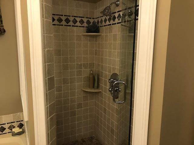 full bathroom with a stall shower