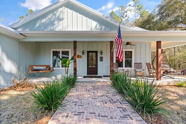 entrance to property with a porch and board and batten siding