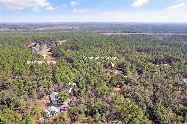 bird's eye view featuring a forest view