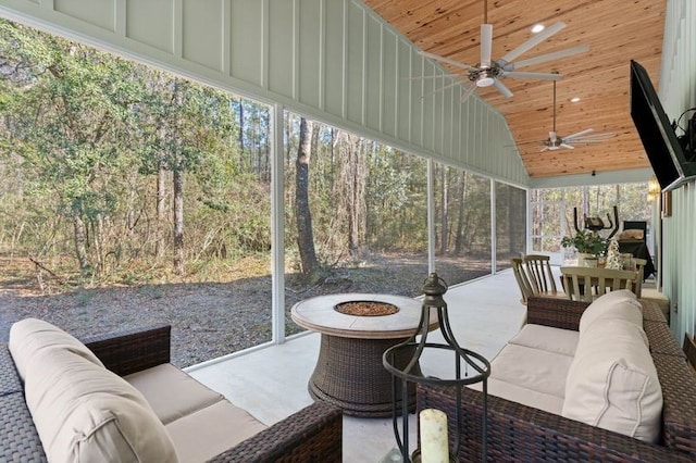 sunroom / solarium featuring wooden ceiling and ceiling fan