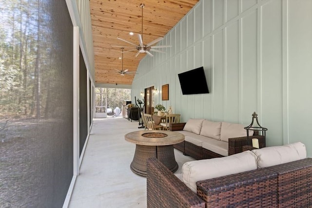 living area featuring wood ceiling, high vaulted ceiling, and ceiling fan