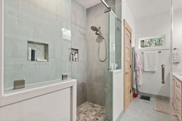 full bath featuring visible vents, walk in shower, and vanity