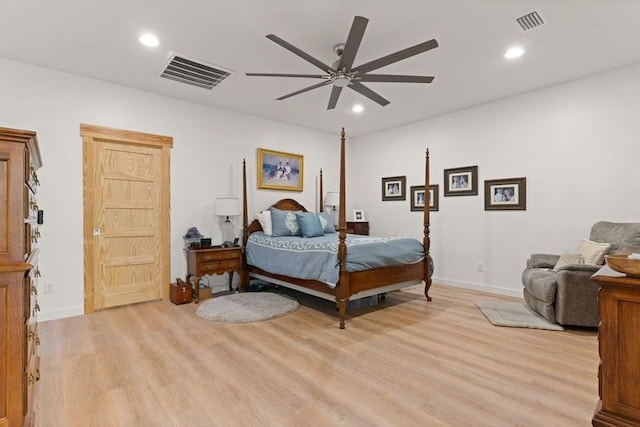 bedroom with light wood-style flooring, visible vents, and recessed lighting