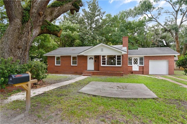 ranch-style house featuring a garage and a front lawn