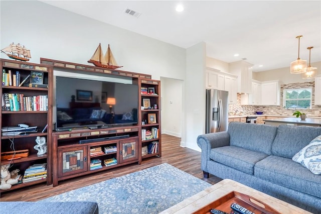 living room featuring dark hardwood / wood-style flooring