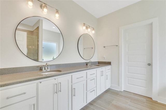 bathroom with hardwood / wood-style flooring and vanity