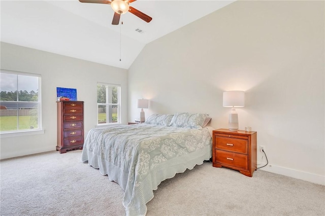 bedroom featuring ceiling fan, light colored carpet, and vaulted ceiling