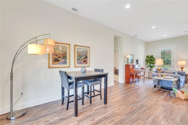 dining room with hardwood / wood-style floors