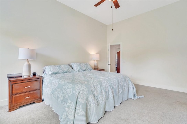 carpeted bedroom featuring high vaulted ceiling and ceiling fan