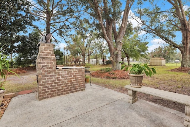 view of patio with a storage shed