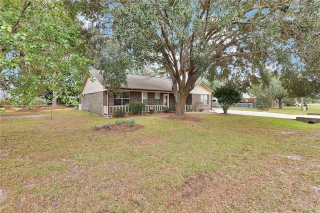 view of front of home featuring a front yard and covered porch