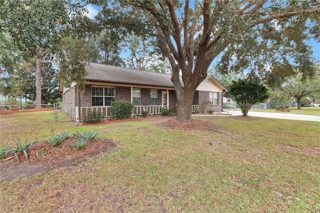 ranch-style home with a front lawn and a porch