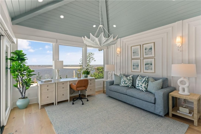 office featuring lofted ceiling with beams, a water view, light wood-type flooring, and wood ceiling