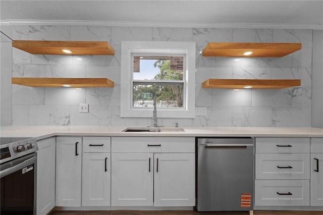 703 Wayne St, Darien, GA 31305 - kitchen featuring open shelves, stainless steel appliances, crown molding, a sink, and backsplash