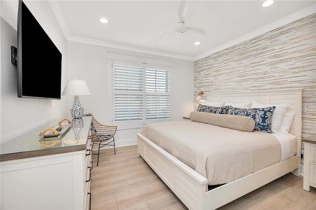 bedroom with ceiling fan, ornamental molding, and light hardwood / wood-style flooring