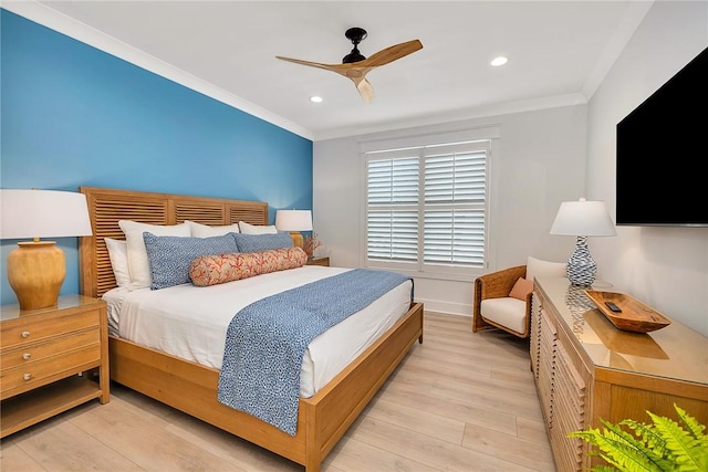 bedroom with ceiling fan, crown molding, and light hardwood / wood-style floors