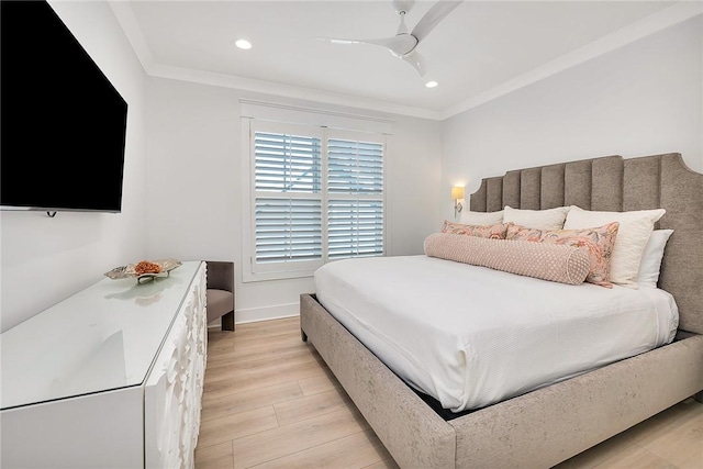 bedroom featuring light wood-type flooring, ceiling fan, and ornamental molding