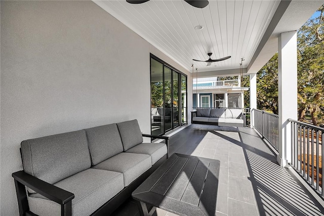 view of patio featuring outdoor lounge area, a balcony, and ceiling fan