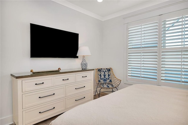 bedroom featuring crown molding