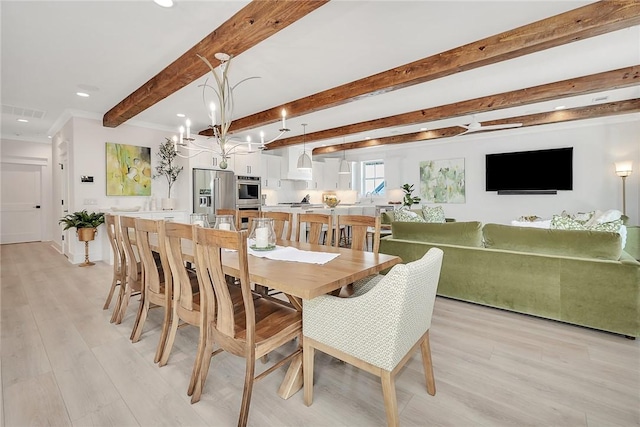 dining space featuring beamed ceiling, light wood-type flooring, and a chandelier