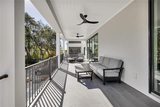 balcony featuring an outdoor hangout area and ceiling fan