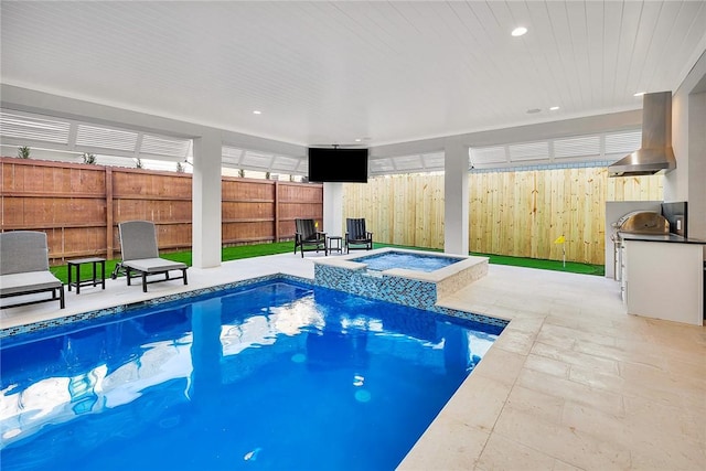 view of pool featuring an in ground hot tub