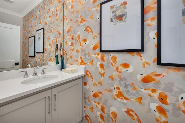 bathroom with vanity and crown molding