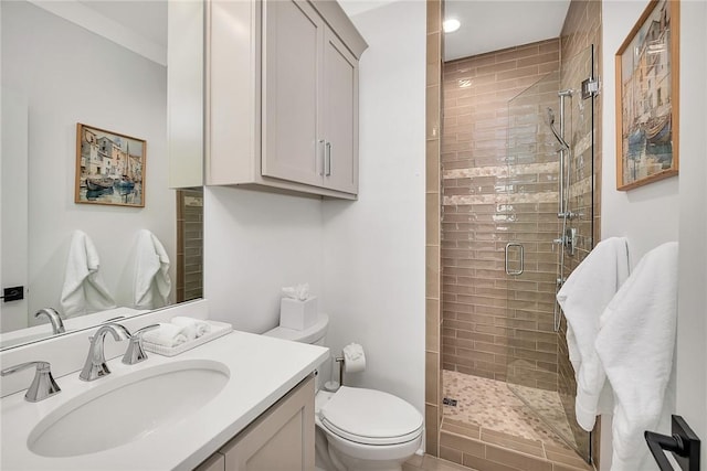 bathroom featuring vanity, toilet, and an enclosed shower