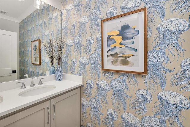 bathroom with vanity and crown molding