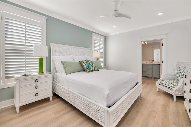 bedroom with ceiling fan, ensuite bath, ornamental molding, and light hardwood / wood-style flooring