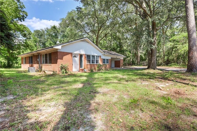 4365 US Highway 341, Jesup, GA 31545 - ranch-style house with brick siding, a front yard, and a garage