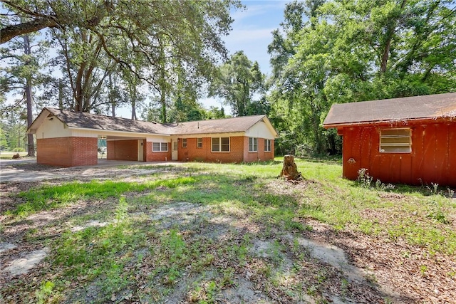4365 US Highway 341, Jesup, GA 31545 - view of front facade with a carport, brick siding, and driveway