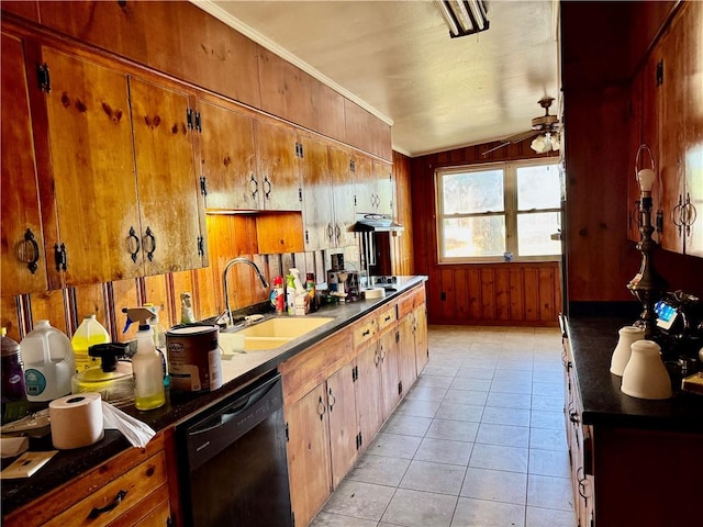 kitchen with ceiling fan, brown cabinetry, dark countertops, dishwasher, and a sink