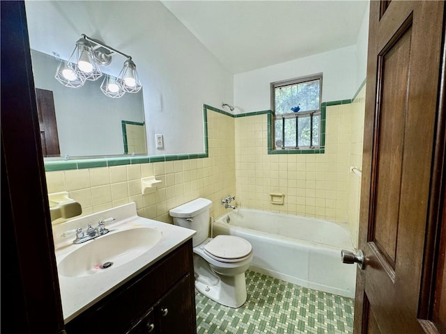 full bath with tile walls, tile patterned flooring, vanity, toilet, and tub / shower combination