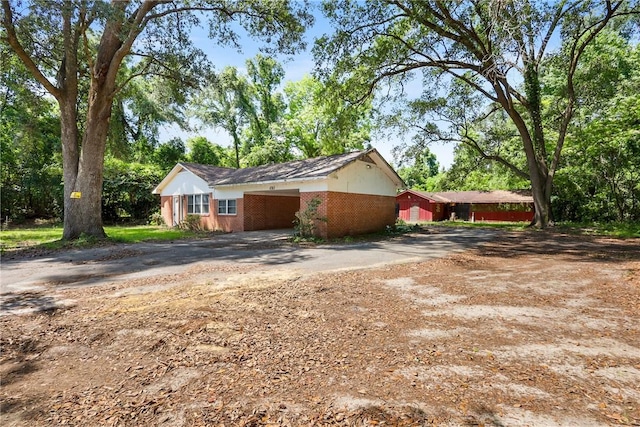4365 US Highway 341, Jesup, GA 31545 - view of home's exterior with driveway, brick siding, and a carport