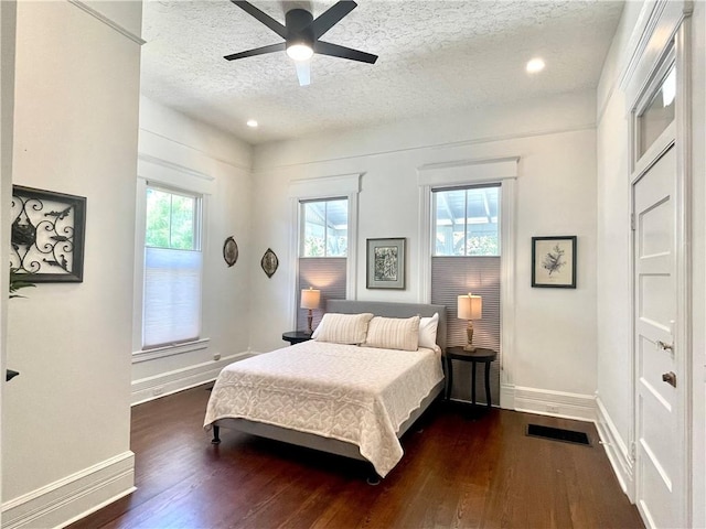 1915 Union St, Brunswick, GA 31520 - bedroom with a textured ceiling, dark wood finished floors, baseboards, a ceiling fan, and recessed lighting