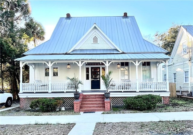 1915 Union St, Brunswick, GA 31520 - view of front of property featuring a porch, a chimney, and a standing seam roof