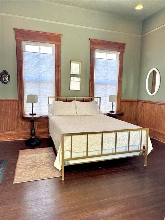1915 Union St, Brunswick, GA 31520 - bedroom with wainscoting, wooden walls, and wood finished floors