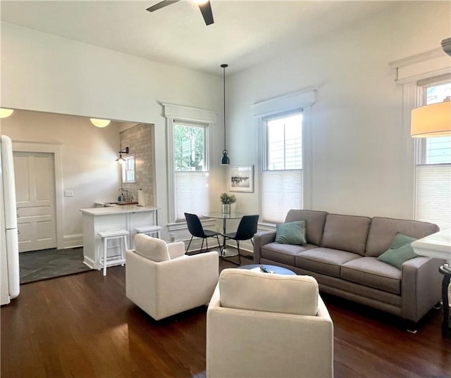 1915 Union St, Brunswick, GA 31520 - living area featuring dark wood finished floors, ceiling fan, and plenty of natural light