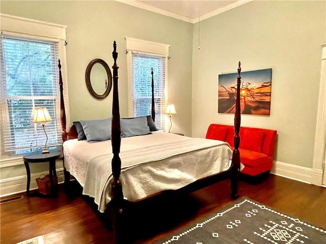 1915 Union St, Brunswick, GA 31520 - bedroom featuring wood finished floors, baseboards, multiple windows, and crown molding