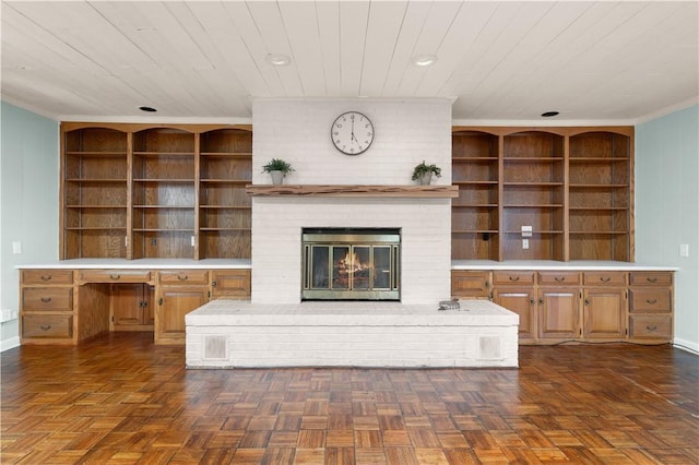 3120 Willow Ave, Brunswick, GA 31520 - unfurnished living room with a brick fireplace, wood ceiling, ornamental molding, built in shelves, and baseboards