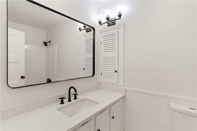 3120 Willow Ave, Brunswick, GA 31520 - bathroom featuring crown molding, vanity, wainscoting, toilet, and a shower