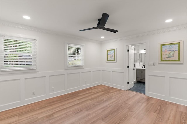 3120 Willow Ave, Brunswick, GA 31520 - unfurnished room with a decorative wall, plenty of natural light, ceiling fan, light wood-style flooring, and crown molding