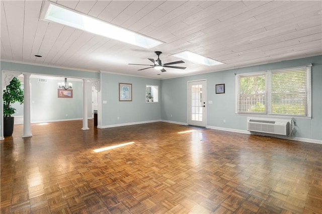 3120 Willow Ave, Brunswick, GA 31520 - unfurnished living room with ornate columns, a ceiling fan, a skylight, a wall mounted AC, and wooden ceiling