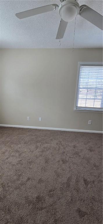 146 Don El St, Brunswick, GA 31523 - spare room featuring a textured ceiling, carpet flooring, and a ceiling fan
