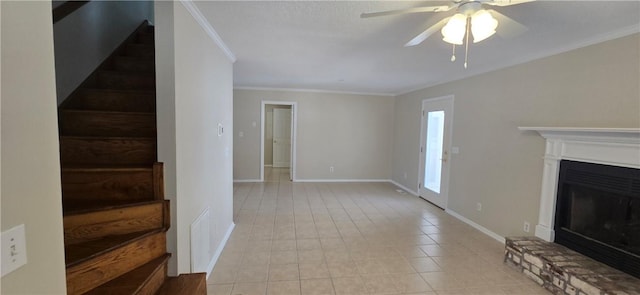 146 Don El St, Brunswick, GA 31523 - unfurnished living room featuring stairs, ceiling fan, ornamental molding, light tile patterned flooring, and a fireplace with raised hearth