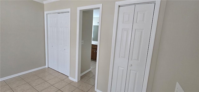146 Don El St, Brunswick, GA 31523 - unfurnished bedroom with two closets, light tile patterned floors, and crown molding