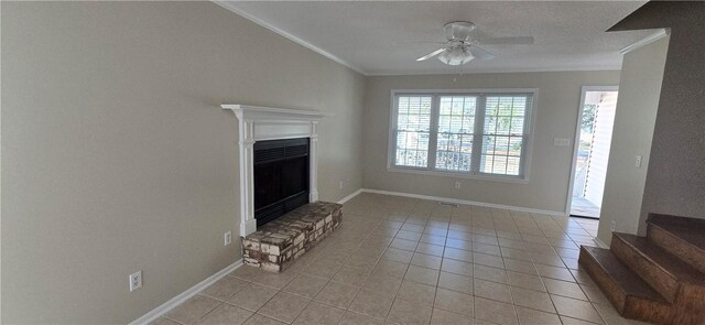 146 Don El St, Brunswick, GA 31523 - unfurnished living room featuring crown molding, ceiling fan, light tile patterned flooring, a fireplace with raised hearth, and stairs