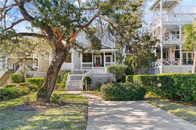 view of front facade with covered porch and stairway